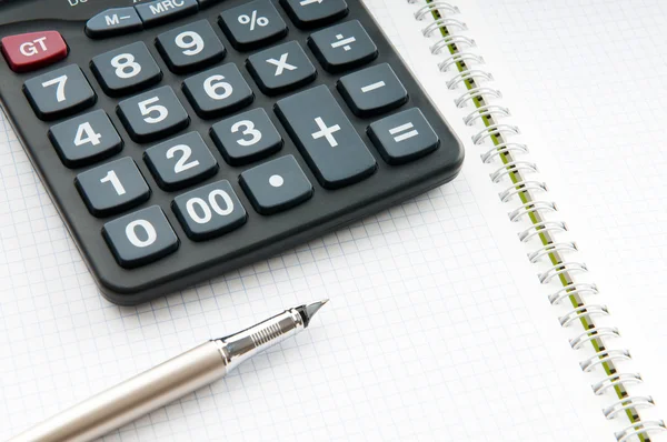 Business concept with notepad and calculator — Stock Photo, Image