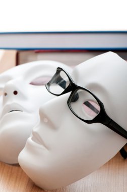 Reading concept with masks, books and glasses