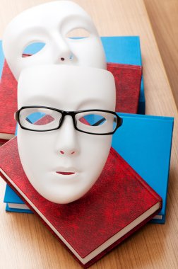 Reading concept with masks, books and glasses