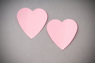 Heart shaped sticky notes on the background clipart