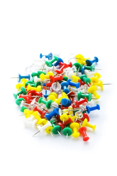 Many colourful office pins isolated on the white — Stock Photo, Image