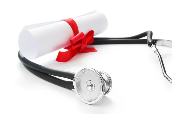 Education concept with diploma and stethoscope on white — Stock Photo, Image