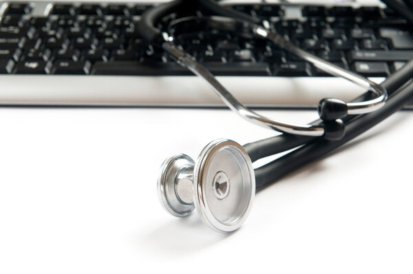 Stethoscope and keyboard illustrating concept of digital securit