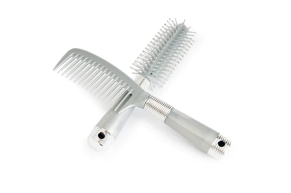 Escovas de cabelo cinza isoladas no fundo branco — Fotografia de Stock