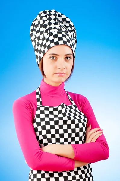 Jonge vrouwelijke kok tegen achtergrond met kleurovergang — Stockfoto