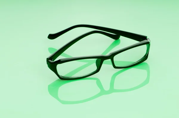Lectura óptica gafas en el fondo — Foto de Stock