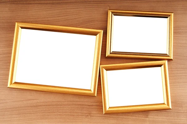 Картинные рамки на полированном деревянном фоне — стоковое фото