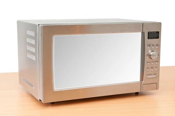 Microwave oven on the table — Stock Photo, Image