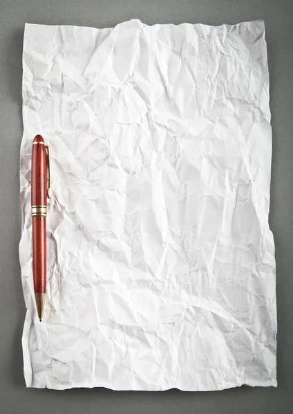 Wrinkled paper background with pen — Stock Photo, Image