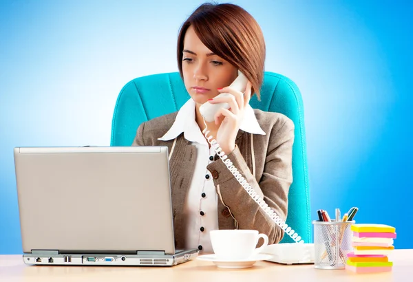 Young business woman working in the office Stock Photo