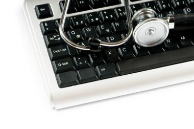 Stethoscope and keyboard illustrating concept of digital securit clipart