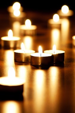 Many burning candles with shallow depth of field clipart