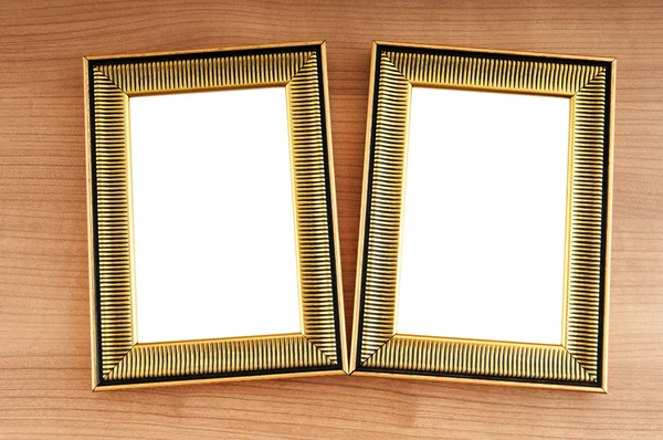 Foto frames op de gepolijste houten achtergrond — Stockfoto