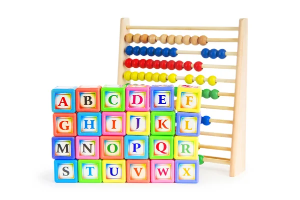 Alphabet blocks and abacus isolated on white — Stock Photo, Image
