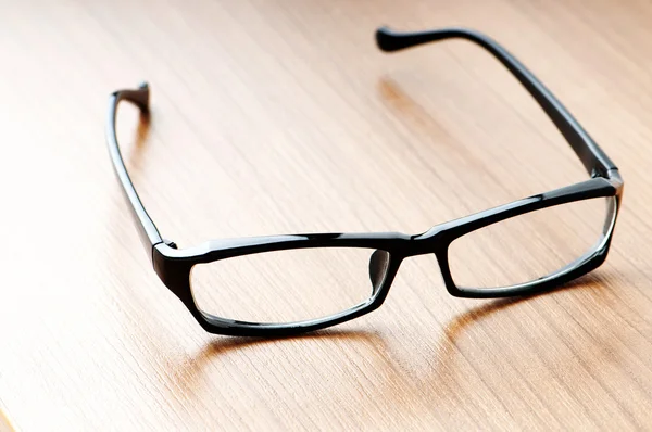 Lectura óptica gafas en el fondo — Foto de Stock