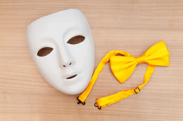 stock image Masks and bow ties on the wooden background