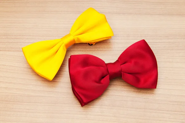 Two bow ties on the wooden background — Stock Photo, Image