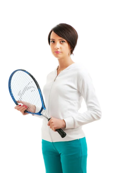 Mladá dívka s tenisovou raketou a bal izolované na bílém — Stock fotografie