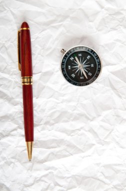 Vintage compass on the paper in adventure concept