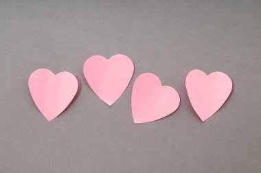 Heart shaped sticky notes on the background clipart