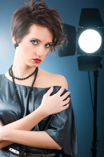 Young attractive girl with in the studio shooting — Stock Photo, Image