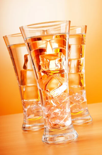 Water in the glass against gradient background — Stock Photo, Image