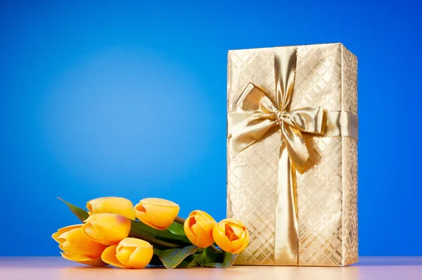 Celebration concept - gift box and tulip flowers — Stock Photo, Image