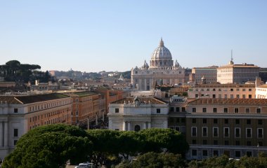 Dome of cathedral of Sainted Peter above the roofs of houses, Rome, Italy clipart