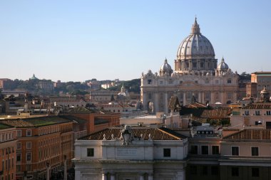 Dome of cathedral of Sainted Peter above the roofs of houses, Rome, Italy clipart