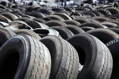 Dump of old automobile tyres clipart