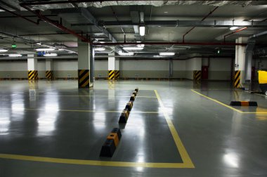 Underground parking of shopping centre, free from cars clipart