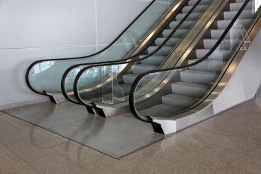 Escalator in a hall of office centre clipart