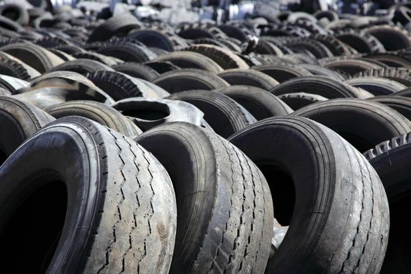 Stock image Dump of old automobile tyres