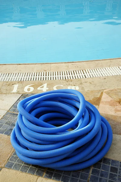stock image Dark blue plastic hose for cleaning of pool