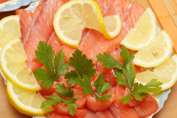 stock image Slices of a salmon on a plate