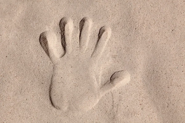 stock image Trace of human hand on sand