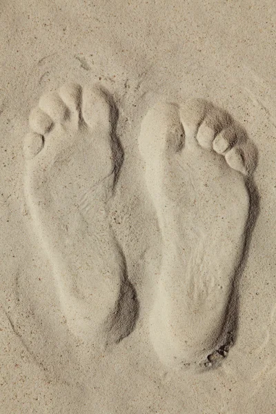 stock image Trace of human feet on sand