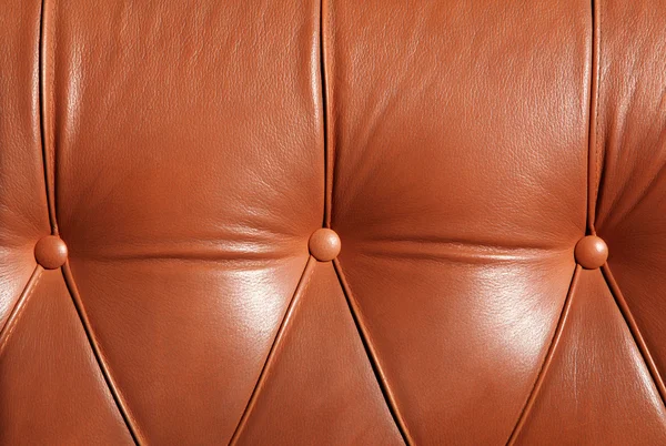 stock image Leather sofa with an upholstery buttons
