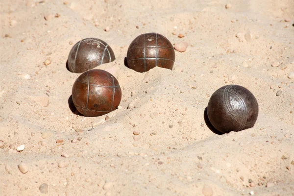Metal spheres for game in boccia, on sand