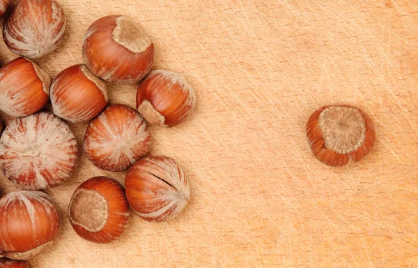 Nuts on wood board — Stock Photo, Image
