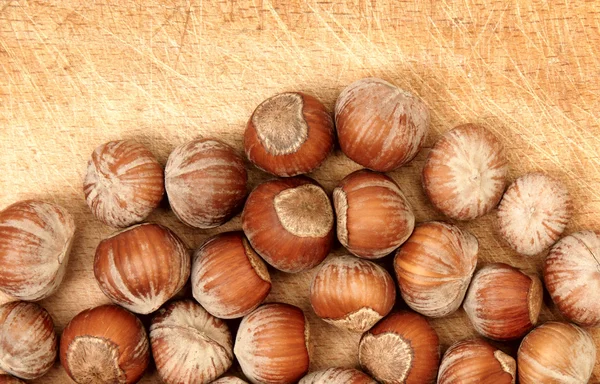 Nuts on wood board — Stock Photo, Image