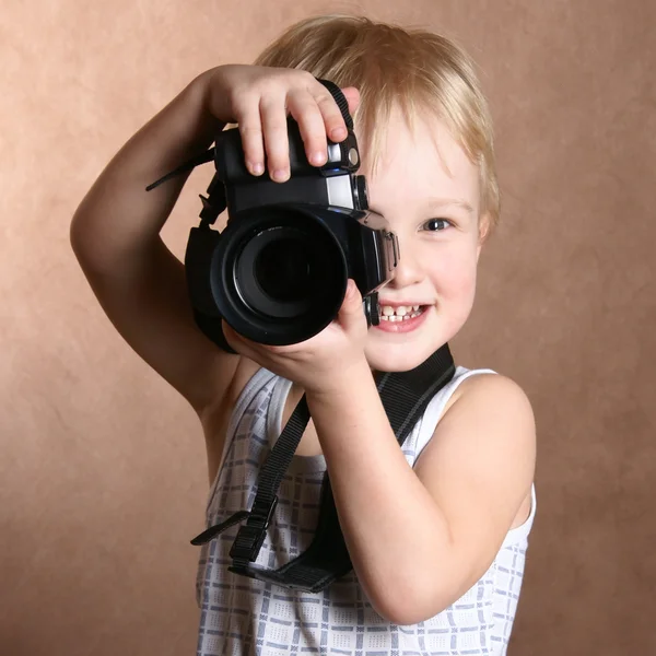 Child with camera — Stock Photo © loskutnikov 4619346