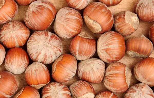 Nuts on wood — Stock Photo, Image