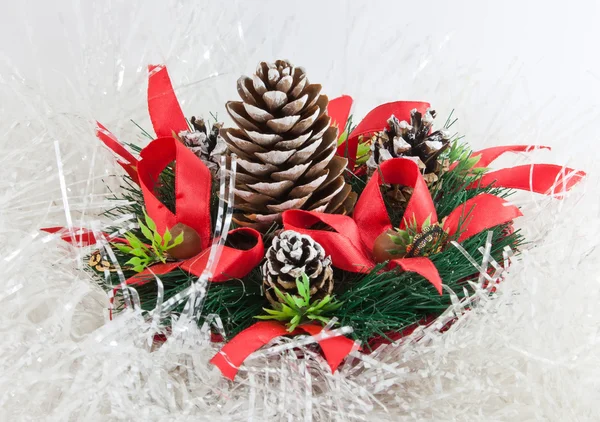 Christmas tree with a pinecone in tinsel — Stock Photo, Image