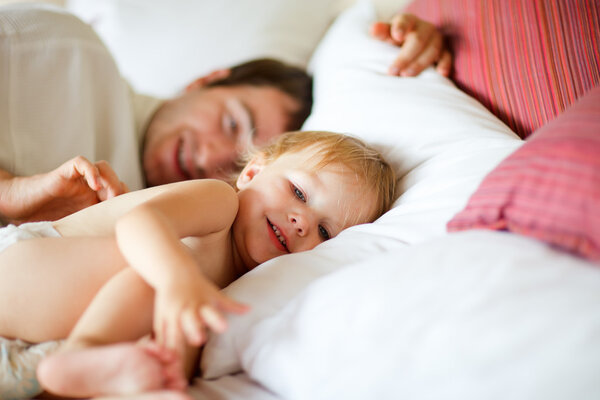 Father and daughter in bedroom