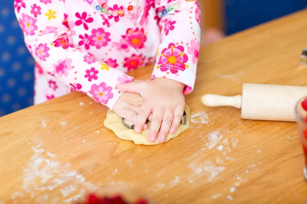 Closeup of toddler girl baking — Stock Photo, Image