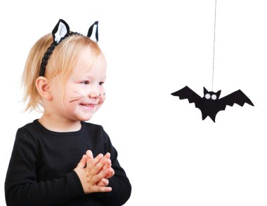 Toddler girl in black cat costume clipart