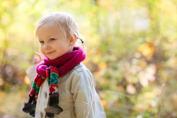 Toddler girl outdoors at autumn day — Stock Photo, Image