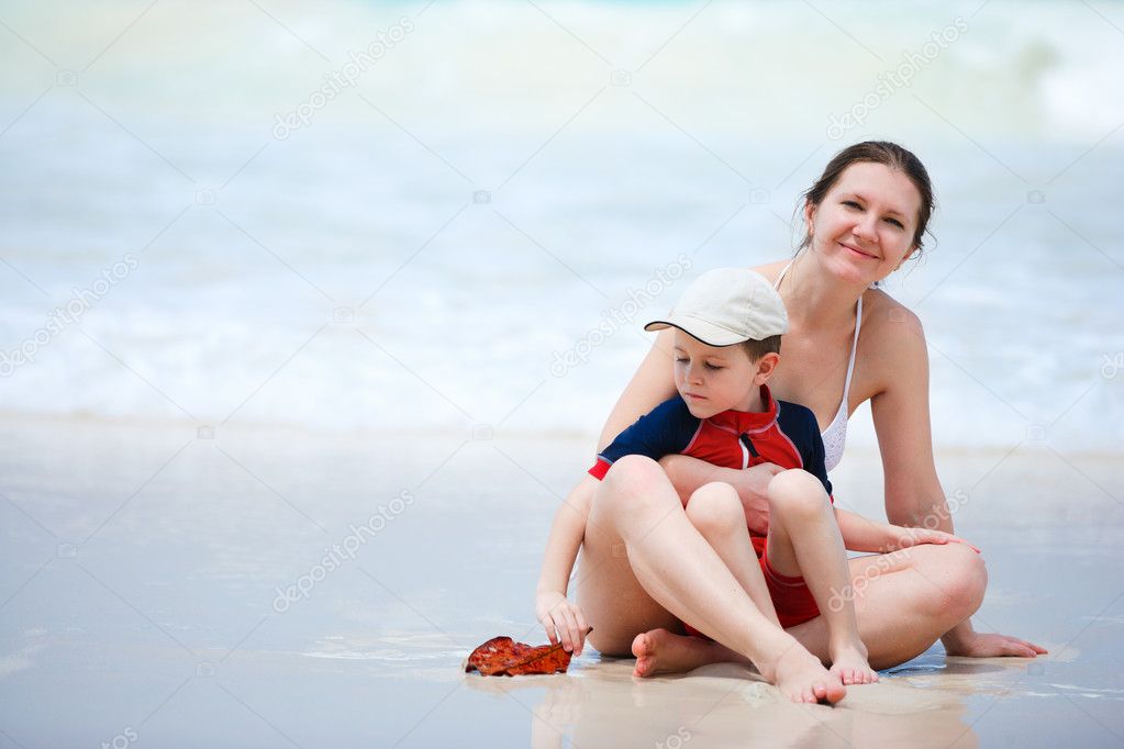 Mother and son having fun beach vacation