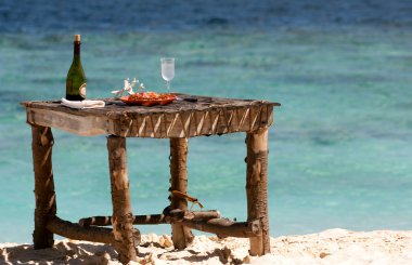 Private picnic on the beach of deserted maldivian island clipart
